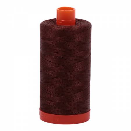 Spool of brown Aurifil Cotton Thread.