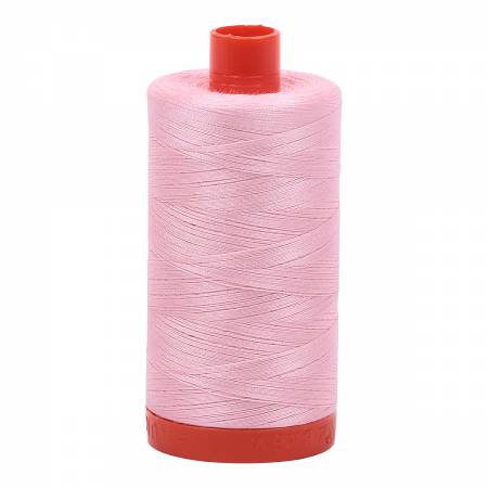 Spool of pink Aurifil Cotton Thread.