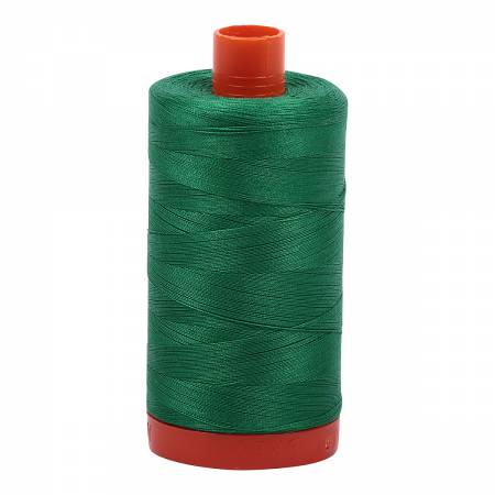 Spool of green Aurifil Cotton Thread.