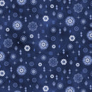 A close-up of a fabric pattern featuring a navy blue background with white and light blue floral, starburst, and geometric motifs.