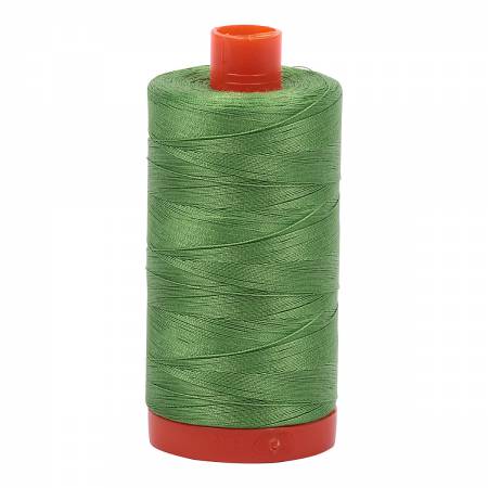 Spool of green Aurifil Cotton Thread.