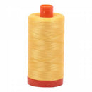 Spool of yellow Aurifil Cotton Thread.