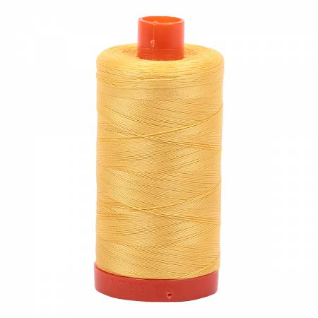 Spool of yellow Aurifil Cotton Thread.