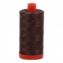 Spool of brown Aurifil Cotton Thread.