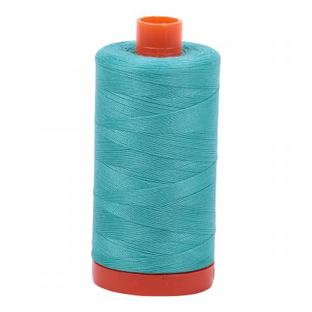 Spool of jade blue-green Aurifil Cotton Thread.