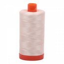 Spool of sand Aurifil Cotton Thread.