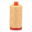 Spool of yellow Aurifil Cotton Thread.
