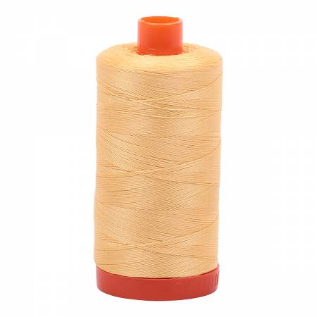 Spool of yellow Aurifil Cotton Thread.