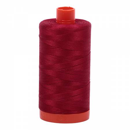 Spool of red Aurifil Cotton Thread.