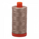 Spool of neutral colored Aurifil Cotton Thread.