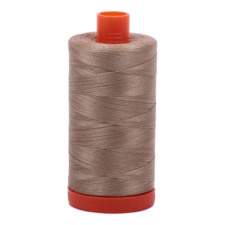Spool of neutral colored Aurifil Cotton Thread.