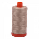 Spool of sand Aurifil Cotton Thread.