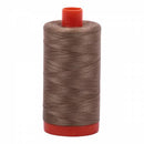 Spool of brown Aurifil Cotton Thread.