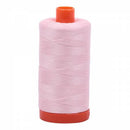 Spool of pink Aurifil Cotton Thread.