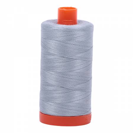 Spool of blue grey Aurifil Cotton Thread.