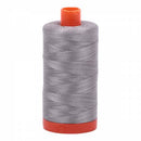 Spool of grey Aurifil Cotton Thread.