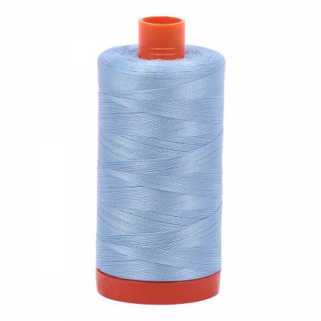 Spool of light blue Aurifil Cotton Thread.