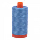 Spool of blue Aurifil Cotton Thread.