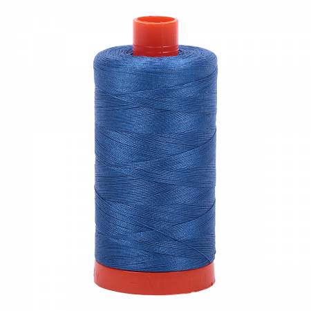Spool of blue Aurifil Cotton Thread.