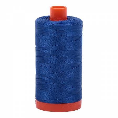 Spool of blue Aurifil Cotton Thread.