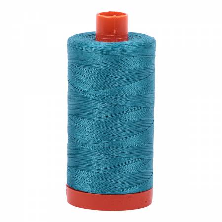Spool of turquoise Aurifil Cotton Thread.