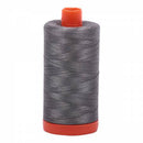 Spool of grey Aurifil Cotton Thread.