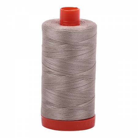 Spool of beige Aurifil Cotton Thread.